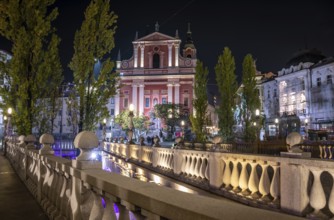 Famous Three Bridges and the Preseren square in the center of Ljubljana illuminated at night,