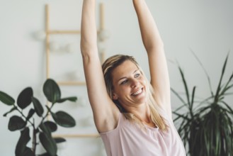 Cheerful happy caucasian woman relaxing at home on her day off work. Adult content woman spending