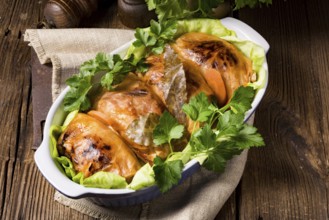 Baked cabbage rolls in tomato sauce