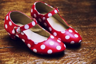 Red dance shoes with white dots