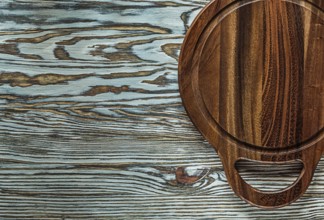 Carving board on vintage wooden surface