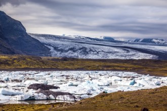 Sunrise in the Ice Lagoon. Drift ice Ice Lagoon - Jokulsarlon. Ice floes are reflected in the