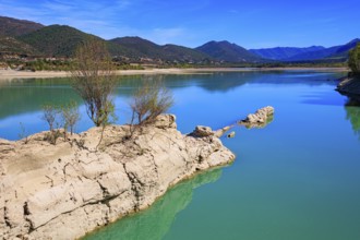 Picturesque backwater. Wonderful autumn day. The La Penia Reservoir collects the waters of the
