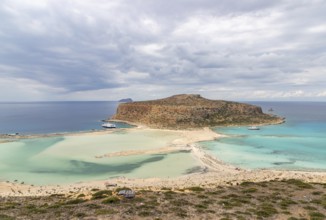A picture of the blue water of Balos Beach and the nearby landscape of the Gramvousa Peninsula