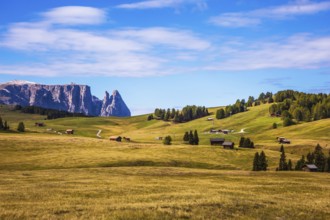 Jagged rocks around the Dolomites valley. The Alps di Siusi. Well-known international ski resort in