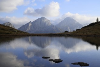 Dolomite peaks are reflected in the valley lakes, Val di Scalve, Lombardy, Italy