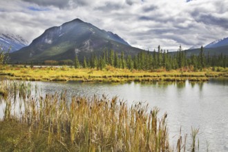 Cold morning on lake in northern mountains in the beginning of autumn