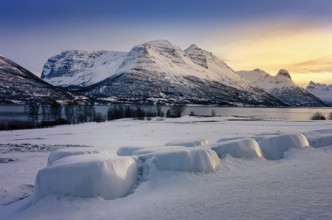 Beautiful winter landscape scene, sunset or sunrise in mountains and fjords