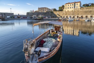 Small traditional fishing boat in Port Tino Rossi, the fishing and pleasure boat harbour near the
