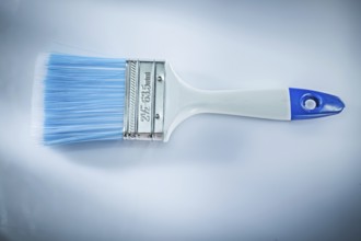 Paintbrush on white background top view