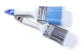 Two white paint brushes with plastic bristle isolated