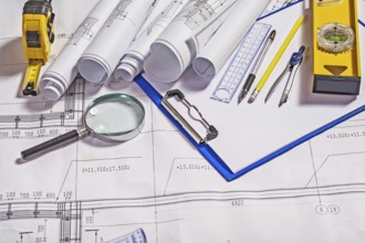 Architect tools on white blueprint construction concept