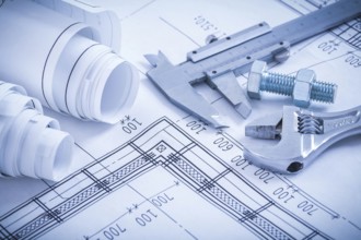 Screw bolt with nut adjustable spanner slide caliper rolls of construction plans on blueprint
