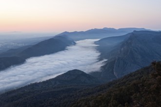 Clouds in the valley and the Wonderland Range at sunrise photographed from the Boroka Lookout in