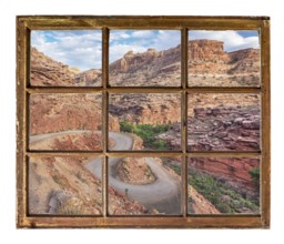 Windy canyon road as seen through vintage, grunge, sash window with dirty glass