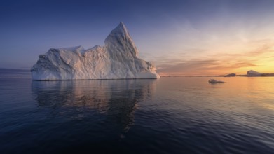 Floating glaciers in the rays of the setting sun at polar night