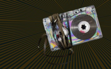 Vintage cassette tape on vintage rays background