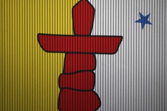 Nunavut Flag painted on the cracked grunge concrete wall