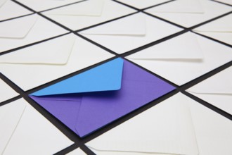 Composition with white and colored envelopes on the table. The photo suitable for various holidays
