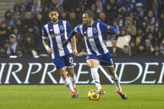 Football match, PEPE FC Porto on the right running with the ball to the left, VARELA FC Porto on