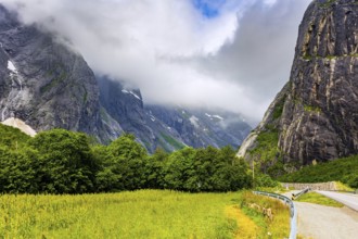 The majestic and famous Troll Wall Trollsvegen. Summer trip to Norway. Warm cloudy day. Northern