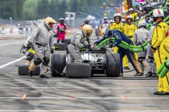 INDYCAR Series driver, RINUS VEEKAY (21) of Hoofddorp, Netherlands, brings his car in for service