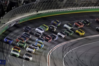NASCAR Cup Driver, AJ Allmendinger (16) races off turn four during the Quaker State 400 Available