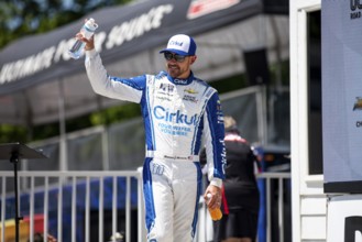 Daniel Hemric walks across the stage during driver intros prior to the Road America 180 at Road