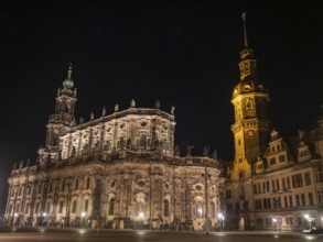 Impressive baroque church with sculptures and bell tower illuminated at night, Dresden, Saxony,