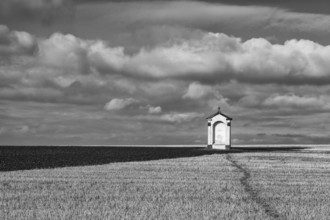 A small chapel in the middle of autumn fields