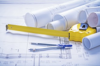 Tapeline compass rolls of blueprints