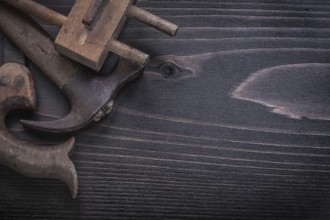 Top view of messy hand saw surface gauge claw hammer
