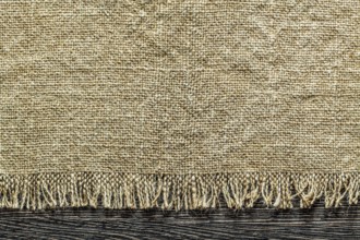 Vintage sacking fabric on wooden board