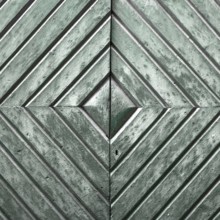 Details of an old wooden door with diamond pattern