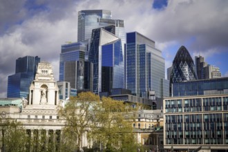 Modern London skyline with prominent skyscrapers and cloudy sky, London, England, United Kingdom