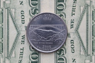 A quarter of West Virginia on US dollar bills. Symmetric composition of US dollar bills and a
