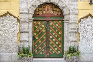 Ornate historic door with detailed stone and colour pattern in an urban setting, tallinn, estonia