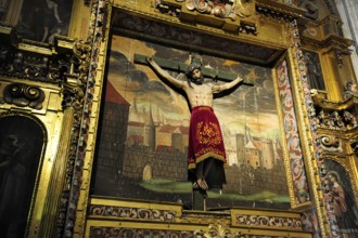 Crucifix in front of a painting in the cathedral, historic city centre, UNESCO World Heritage Site,