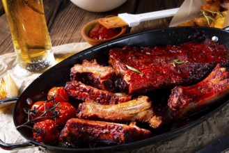 Grilled ribs in a spicy marinade with salad and vegetables