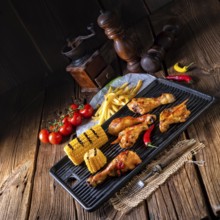 Rustic Grilled chicken wings, legs, and spicy corn