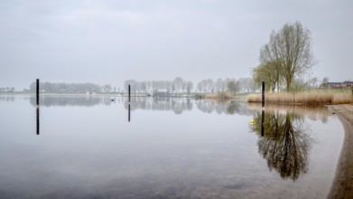 Dutch river landscape. View from the Island of Maurik in Gelderland, Netehralds