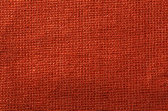 Cotton textile background. Red closeup textile texture