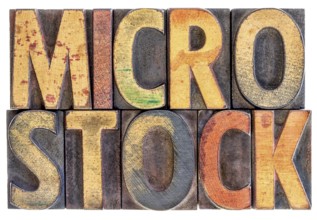 Microstock photography concept - isolated word abstract in vintage letterpress wood block type,