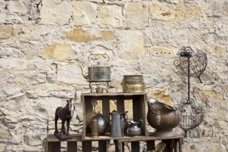 Still life in front of a natural stone wall