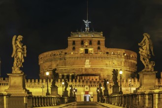 View of angel sculpture on Ponte Sant'Angelo and Castle of the Holy Angel, Rome. Evening