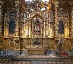 Segovia, Spain, 7 April, 2024: detail view of a gilded altar piece in a side chapel of the Segovia