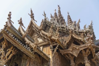 Close-up of an ornately carved wooden temple with lots of detail, Pattaya, Thailand