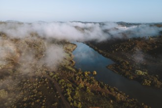 Drone shot, river course, low cloud cover