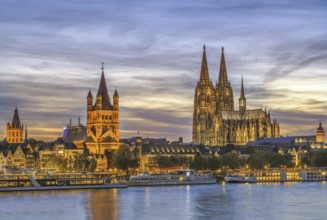 View of historical center of Cologne from Rhine river in evening, Germany