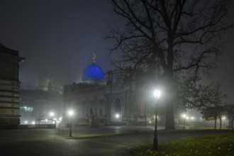 Dresden's old town shrouded in November fog. Brühl's Garden. View of the Lipsius Building, Foggy
